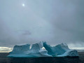 "Ice Arch Under a Cloudy Sun"